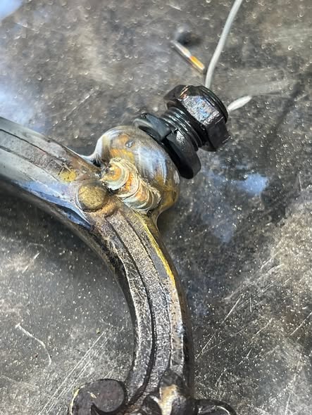 TIG weld repair on a brass chandelier arm