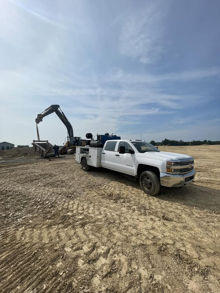 Welding service truck parked at an excavation job site