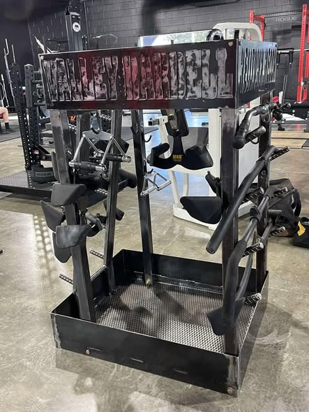 Custom black steel attachment rack built for a gym